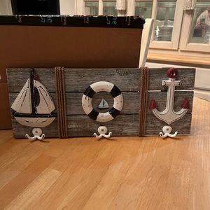 Adorable sailor hanging decor with hooks.